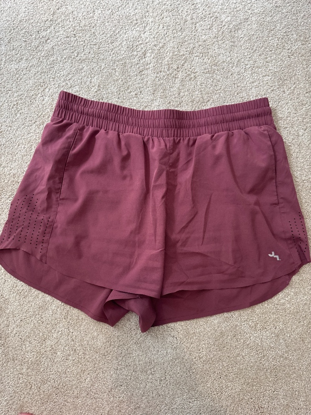 Athletic shorts with pockets and mesh sides
